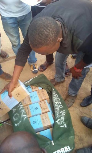 A photograph of the parliamentary ballot papers being inspected