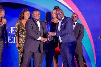 Gayheart Mensah, Director for External Affairs at Vodafone Ghana receiving an award