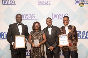 Staff of First National bank at the CIMG event holding their award