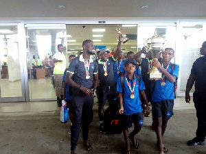 Lizzy Academy with their trophy at the Airport