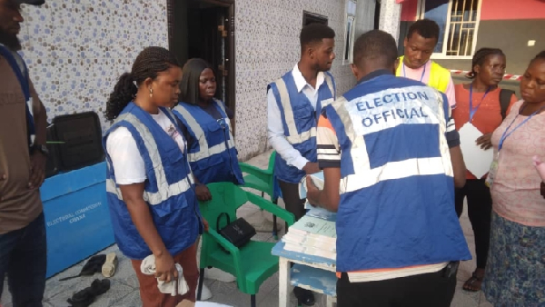 EC officials sorting ballot papers