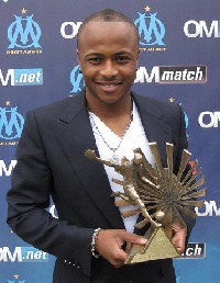 Swansea winger Dede Ayew with the last BBC award he won while in France