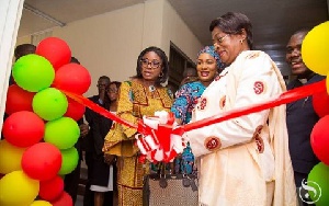Chief Justice, Sophia Akuffo with Second Lady, Samira Bawumia cutting the tape