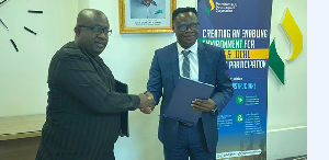 Dr Aubynn (L) In A Handshake With CEO Mannschaft Engineering, Mr  Adu.png