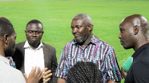 Deputy Sports Minister, Perry Okudzeto (m) interacting with the CAF Inspection team