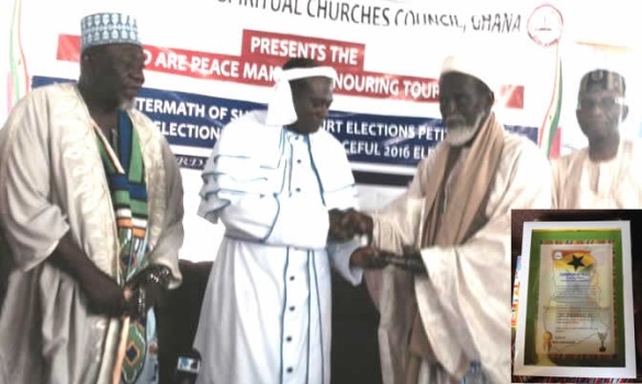 prophet N'akoa Nazareth Ansah Jamson (2nd L) presenting citation to Shiekh Shaributu.