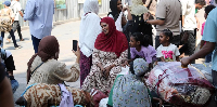 Sudanese nationals wait to enter Ramses railway station in Cairo, Egypt, ahead of their return