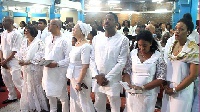 The family clad in white at the memorial service of the late Jake Obetsebi Lamptey