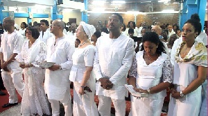 The family clad in white at the memorial service of the late Jake Obetsebi Lamptey