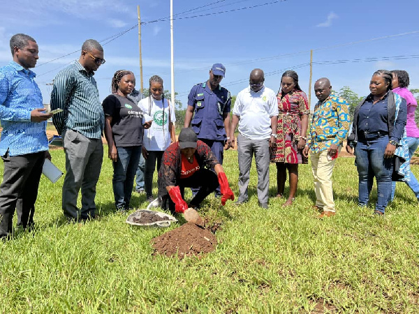 The MCE Hon. Elizabeth Kaakie Mann planting a tree