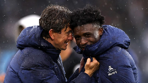 Tottenham Hotspur manager Thomas Frank (L) and Mohammed Kudus (R)