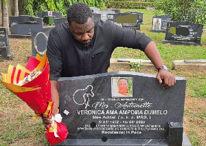 John Dumelo at the grave of his mother