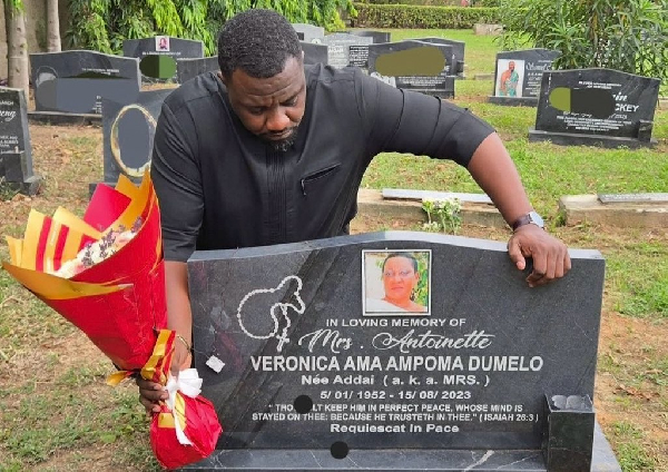 Emotional scenes as John Dumelo pays visit to mother's grave two years after her passing
