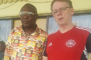 John Christensen in a pose with Dr. Kwaku Frimpong, one of the new owners of Ashantigold FC