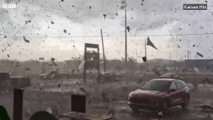 Screenshot from a video of a tornado causing havoc