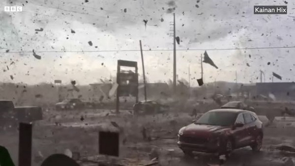 Screenshot from a video of a tornado causing havoc