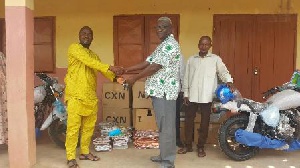 A representative receives the donations on behalf of Mion District Directorate of Education