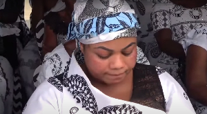 A tearful Empress Gifty at the funeral of her mother