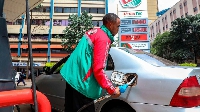 Customer attendant at Rubis Petroleum Station on Koinange Street, Nairobi County, Kenya