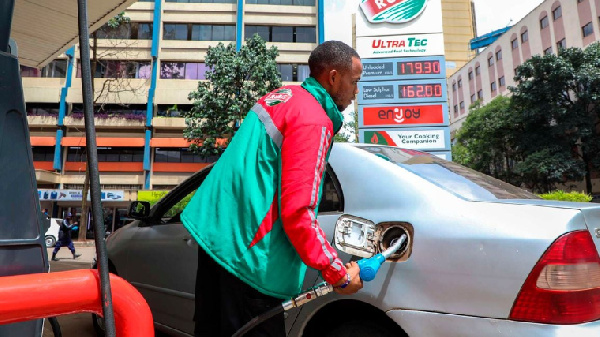 Customer attendant at Rubis Petroleum Station on Koinange Street, Nairobi County, Kenya