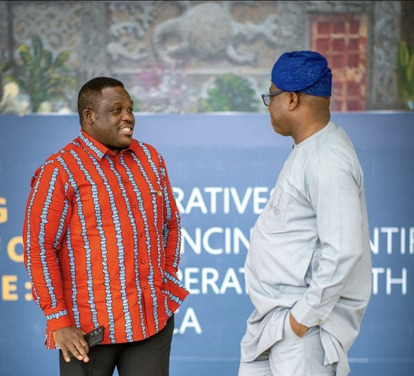 A photo of Sam George and Murtala Mohammed having a warmth moment together