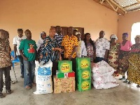 The items include bags of rice, sugar, cooking oil, canned fish and tomatoes
