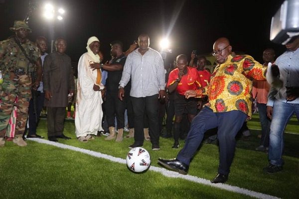 President Akufo-Addo gives the first kick in the newly commissioned stadium