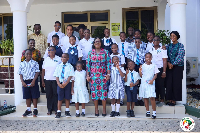 The school children with Obuobia Darko-Opoku during their visit
