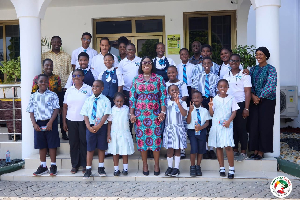 The school children with Obuobia Darko-Opoku during their visit