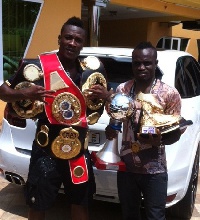IBO Lightweight king, Emmanuel Tagoe with promoter and manager, Asamoah Gyan
