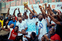 Players and officials of Union Ghana with the trophy