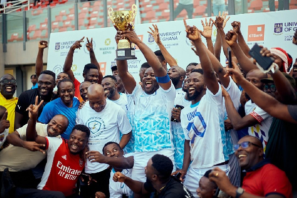 Players and officials of Union Ghana with the trophy