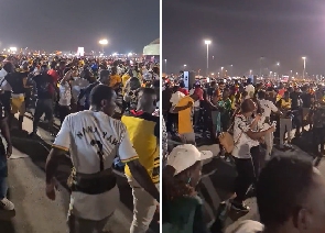 Fans of the Black Stars dance in celebration of Uruguay's loss