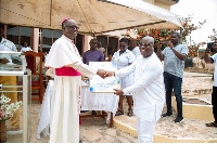 Mr. Kutortse receiving a citation of honour from the Most Rev. Fianu SVD