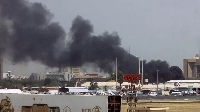 Columns of smoke rose on Thursday near the presidential palace in Khartoum