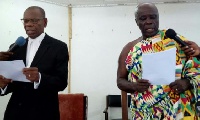 Okyenhene Amoatia Ofori Panin (R) was sworn in by High Court Judge Justice Kwabi (L)