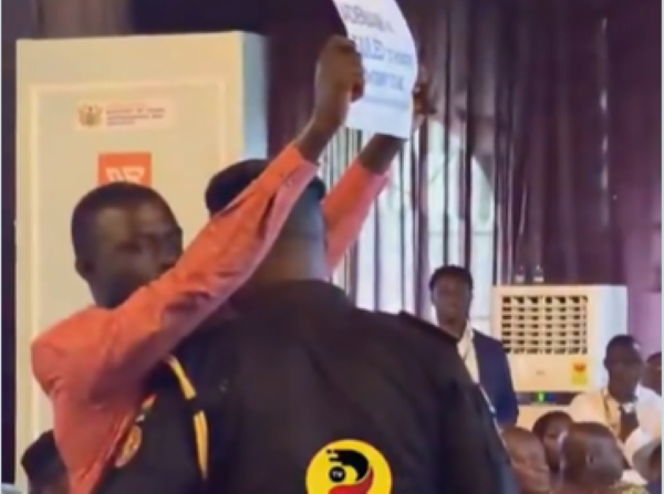 Security personnel approached the man and calmly escorted him out of the venue to address the matter