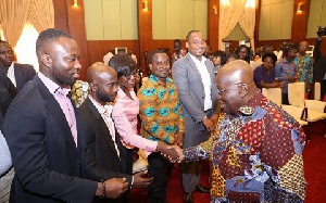 President Nana Akufo-Addo shaking hands with some presidential correspondents