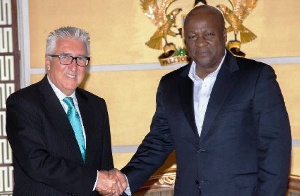 President Mahama exchanging pleasantries with then US Ambassador Gene Cretz