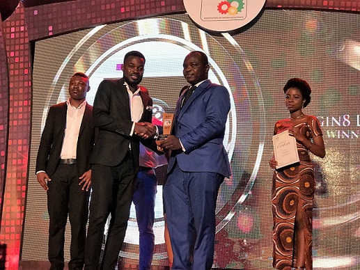 A representative of Origin8 [left] receiving the plaque