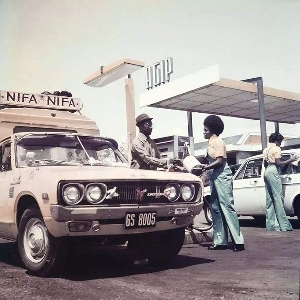 Fuel attendants at an AGIP station in 1970s