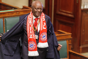 Pierre Kompany wore the Bayern scarf to Parliament