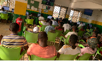 Some youth seen seated at a betting centre