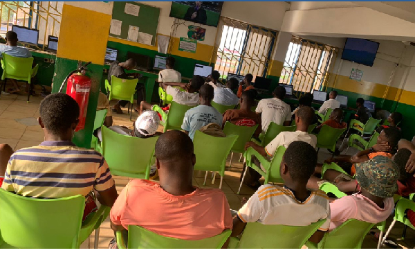 Some youth seen seated at a betting centre