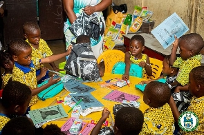 Some pupils with the learning materials donated by the AMA