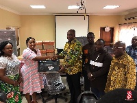 Minister of Education, Dr. Matthew Opoku Prempeh receiving the donation on behalf of NUGS