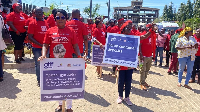 Some demonstrators wielding placards