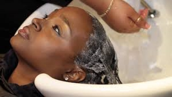 Using warm water to wash the hair opens the pores to rid the hair of dirt
