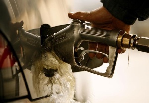 Fuel Overflows As Iranian Man Pumps Gasoline Into His Car Reuters