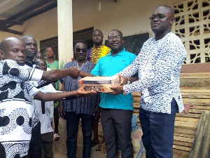 Alfred Obeng Boateng donated bags of cement and other building materials to the community